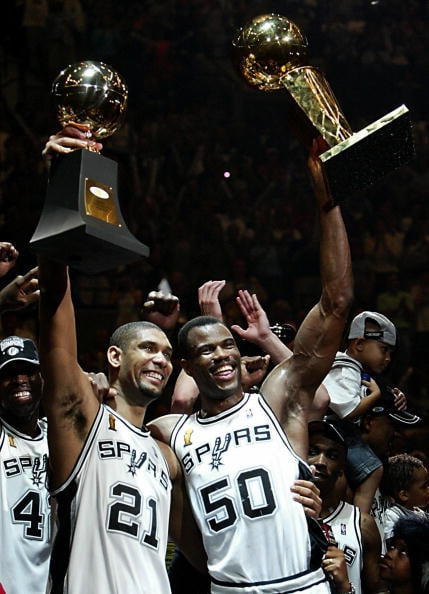 Series MVP Tim Duncan (L) and David Robi